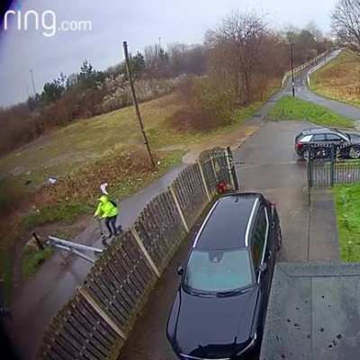 Man on a scooter vs. a steel gate.
