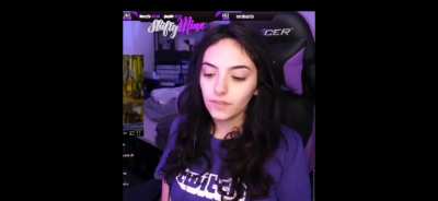 Touching her boobs.