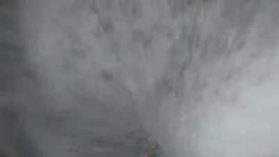 HMRB while I rappel straight through a waterfall. Rio Nero, Italy