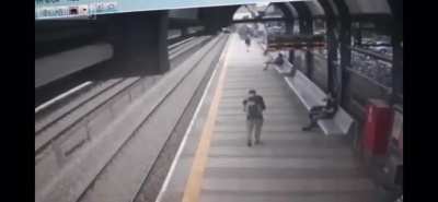 Train platform turned into a bowling alley by suicidal man.
