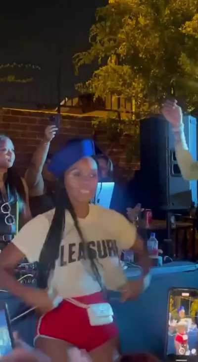 Janelle Monae flashing at a concert