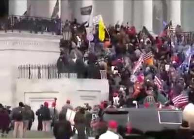 Police officers retreat and rioters storm the capitol