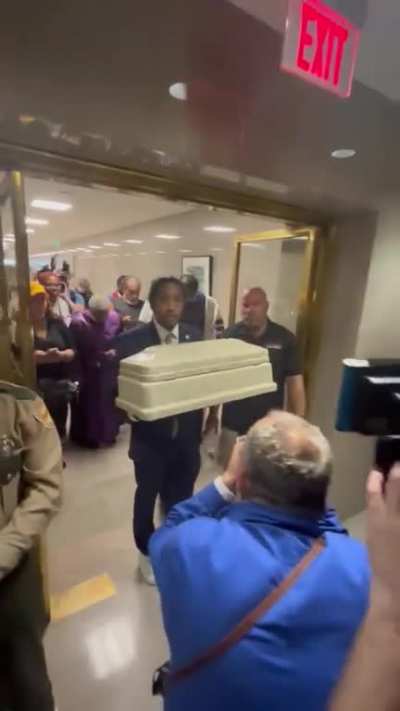 Denied Entry to Capitol, State Rep. Honors Covenant School Shooting Victims with Empty Casket