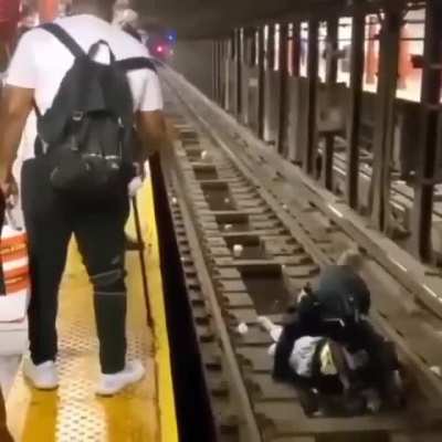 NYPD officer and a good Samaritan jumped to the rescue of a 60 year old man who had a medical condition and collapsed onto the track
