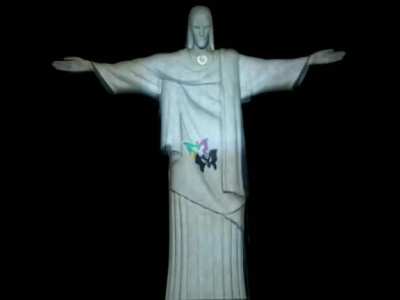 Christ the Redeemer "closed" his arms in a symbolic embrace of Rio de Janeiro. The effect - an optical illusion caused by the projection of lights and images a campaign to combat violence