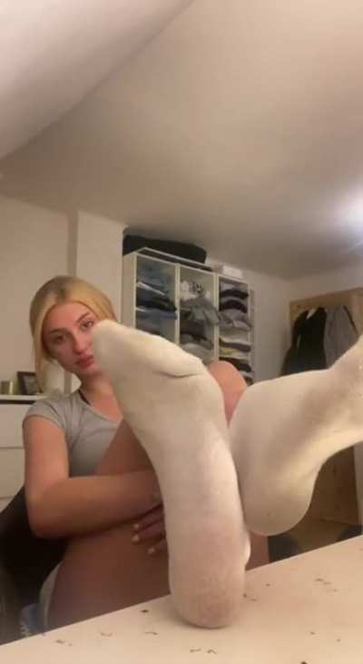 her socks have to smell badly...