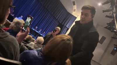 Sheriff Robert Norris attempts to drag one of his constituents out of a public town hall meeting, and threatens to pepper spray her if she does not comply. He claimed he wasn&rsquo;t acting in his official capacity, but he was wearing a sheriff's hat and his ba