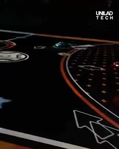 Battle-carts in London using overhead projection to provide AR and game-play.