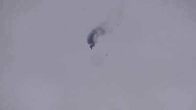 Syrian rebels shoot down Syrian Arab Army Mi-17. You can see the crewmembers falling out of the helicopter as it drops.
