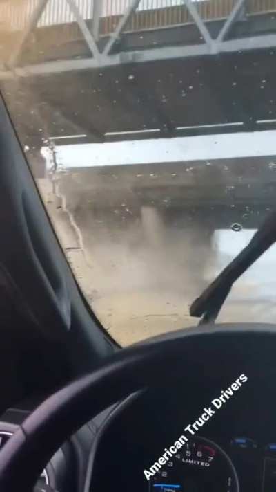 The moment a raised truck bed slams into an overpass