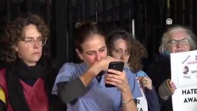 A British doctor breaks down while reading an emergency message from the director of Al-Shifa Hospital in #Gaza, as healthcare workers gather in front of the Prime Minister's office in London, holding banners bearing the names of more than 200 doctors kil