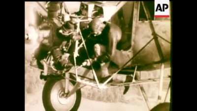 Fred Keys performs in-flight engine maintenance on Curtiss Robin "OLE MISS" during a record breaking 27 day endurance flight in 1935
