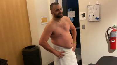 Sammy Guevara being checked on + Eddie Kingston in a towel (from Sammy's latest vlog)