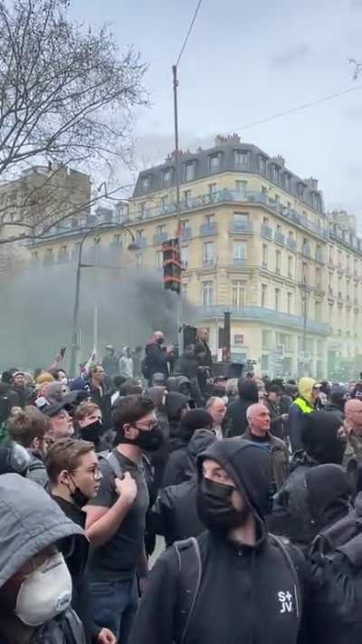 Protesters in France destroying a McDonald's