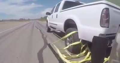 Police car grappler deployed to stop moving vehicle. It aims to end Police chase more safely