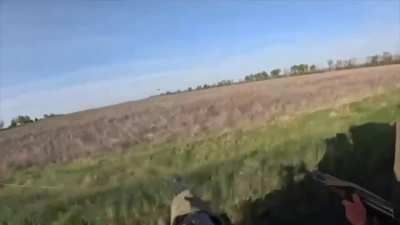 Ukrainian troops shoot down a Russian fiber-optic FPV drone that was following them causing it to crash into trees at the last moment