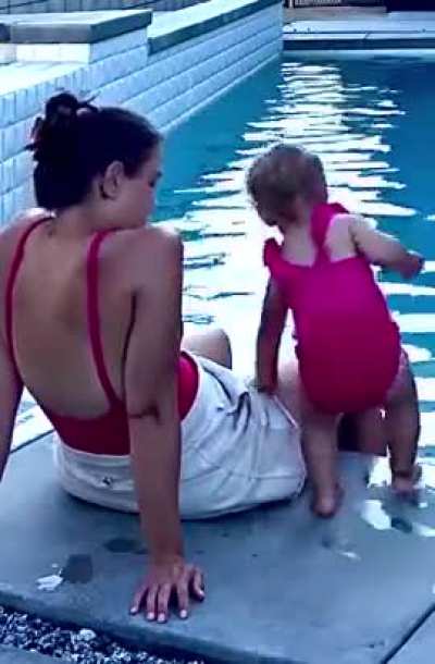 Nicole sitting poolside