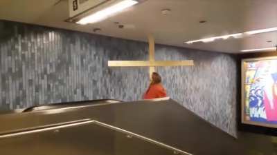 Jesus on an escalator