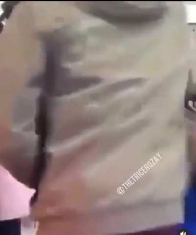 Dude in the suit jacket smiling hard after blue jacket gets slapped to sleep