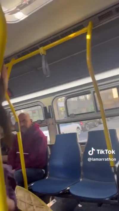 Woman barks at man on bus