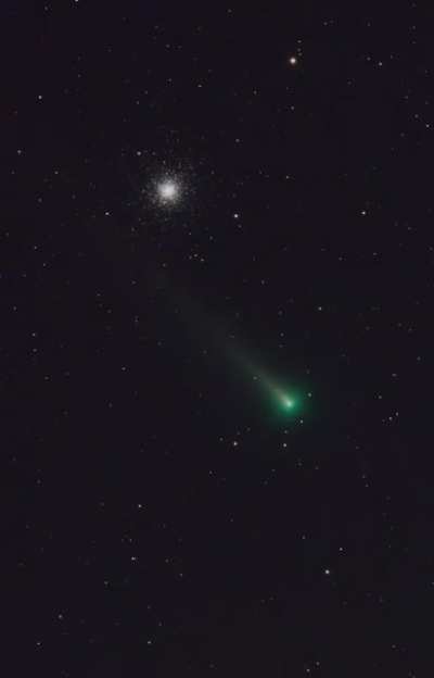 A conjunction of cosmic beauties &mdash; Comet A1/Leonard transiting the M3 globular star cluster. Timelapse of 720 exposures photographed with a 4 inch telescope in my front yard.