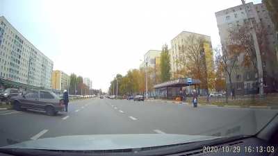 Woman runs across the road in the wrong place