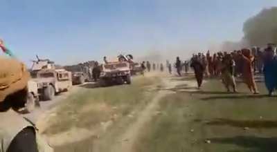 Afghan National Army mass surrendering to the Taliban on June 22, 2021. You can see ANA soldiers handing in all their firearms in a pile as well has handing in their Humvees in a straight line.