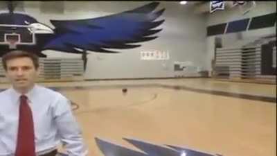Reporter accidentally makes a half court shot