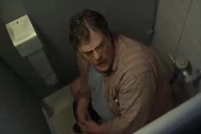 Man on toilet saying, "That's fuckin' great, you wanna leave me alone?"