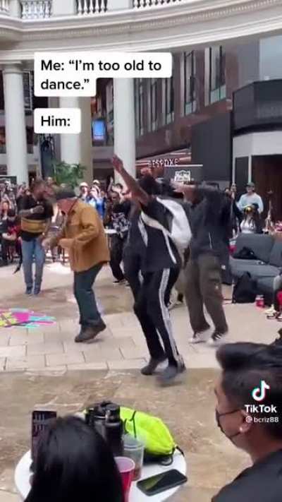 Old man vibing out on the dance floor