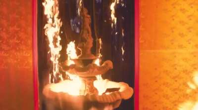 The original "writing fire" gif comes from Young Thug's "Hot" music video featuring Gunna (in the video) and Travis scott