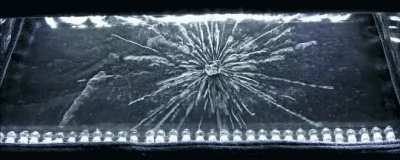 We&rsquo;re used to radiation being invisible. With a Geiger counter, it gets turned into audible clicks. What you see below, though, is radiation&rsquo;s effects made visible in a cloud chamber. In the center hangs a chunk of radioactive uranium, spitting out alpha 