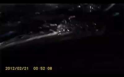Russia: Car gets crushed under a truck