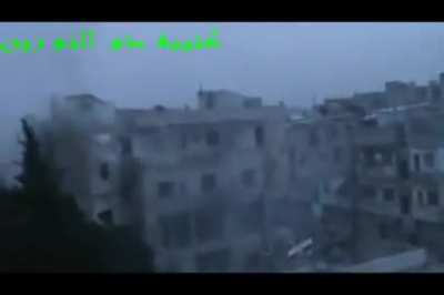 Dhu al-Nourin Battalion fighters expend a lot of ordinance on a building purportedly containing a group of SAA soldiers - Februrary 2012