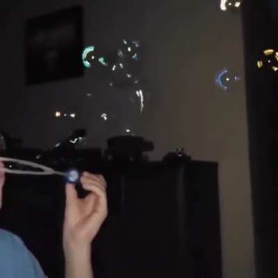 Blowing bubbles in the dark with flash on