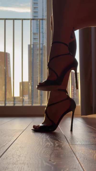 Black Jimmy Choo&rsquo;s and the light peeking through my arches