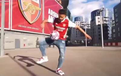 Arsenal fans celebrating their club&rsquo;s promotion to the 2036 Premier League season. (emotional)