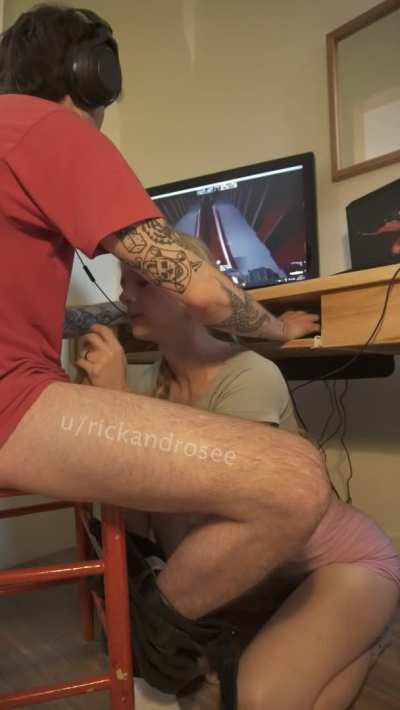 Jacking him off while he games
