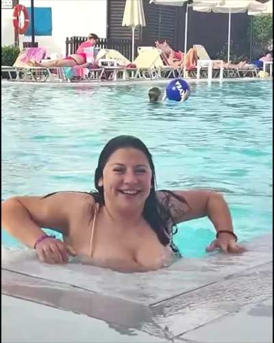 Sam showing off in her pink flower swimsuit