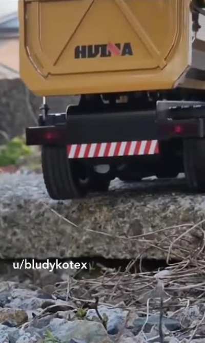 Dump truck driver loses his load.