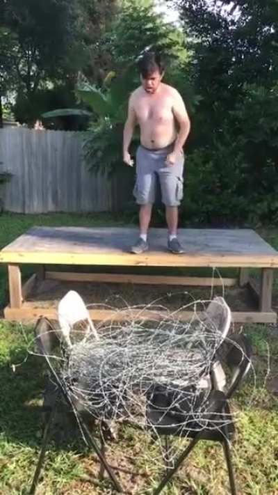 Man jumps into barbed wire.
