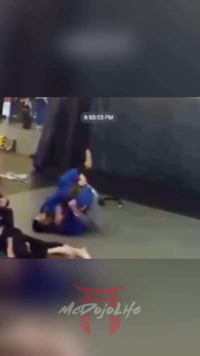 Blackbelt attacks purple belt after being submitted
