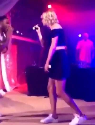 On stage singing "Dilemma"