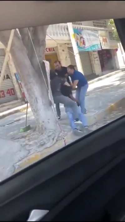 Puebla, Mexico, a business owner attacks a street vendor for setting up in front of his business. After the video went viral, people then set fire to the attackers house
