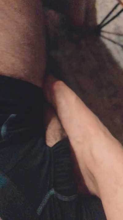 Moaning older bitch pins hung cock down with her foot to hold him down