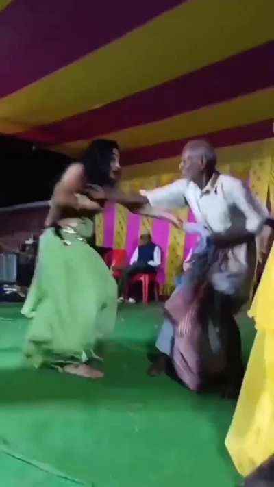 Women hired to dance at a wedding force themselves on this man and attempt to strip him. 