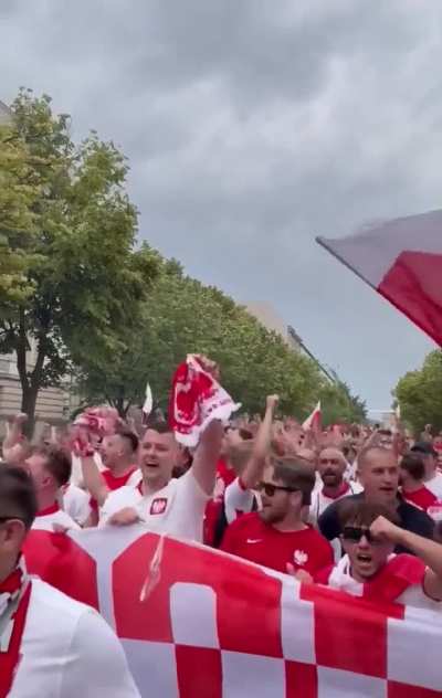 Polish football fans in front of the Russian embassy in Berlin singing &lsquo;Ruska kurwa&rsquo;