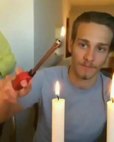 The flame travels down the smoke and relight the candle