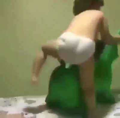 Kid on green thing.
