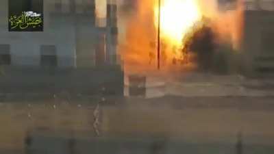 Sunni rebels in Syria firing ATGM at a group of Syrian soldiers.